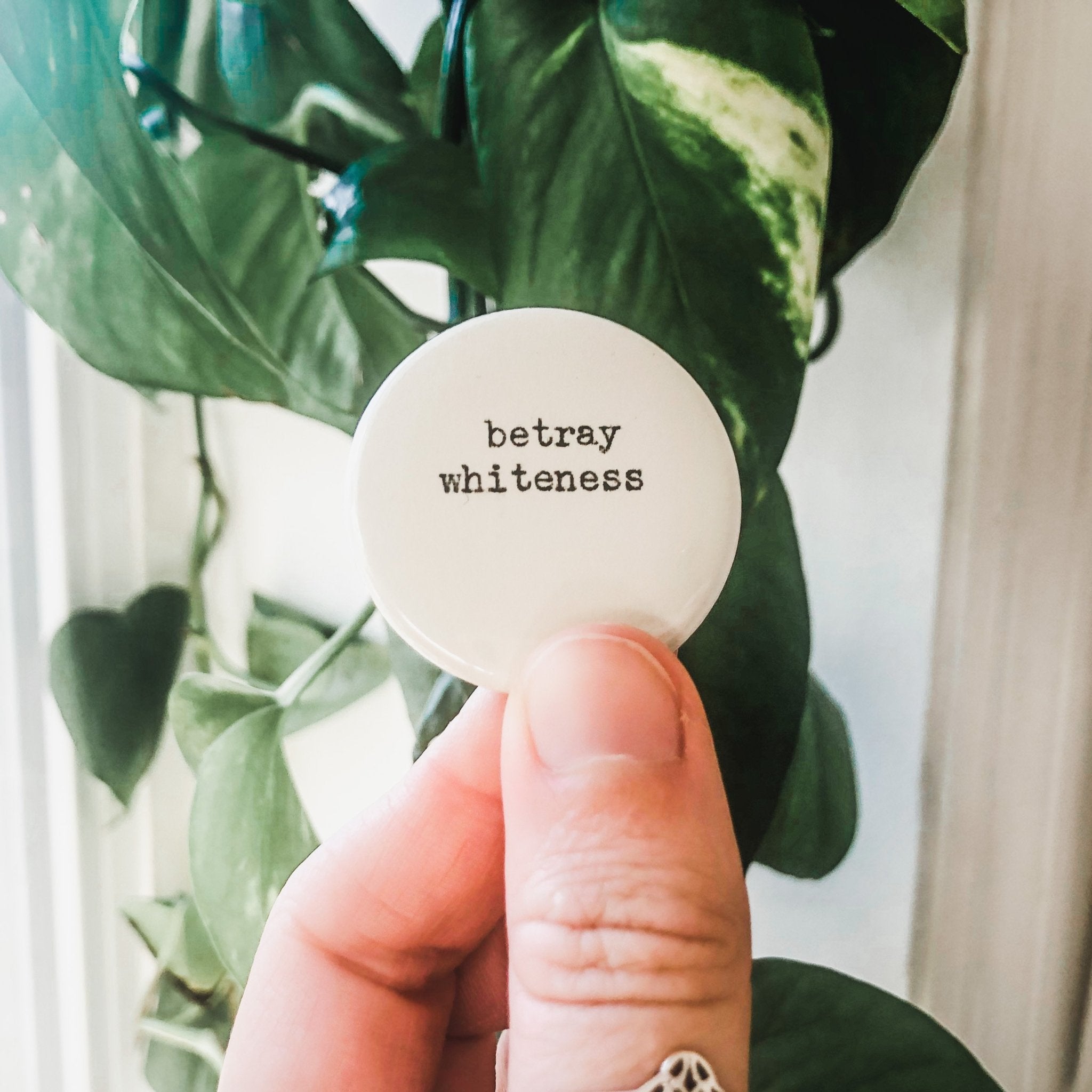 betray whiteness button